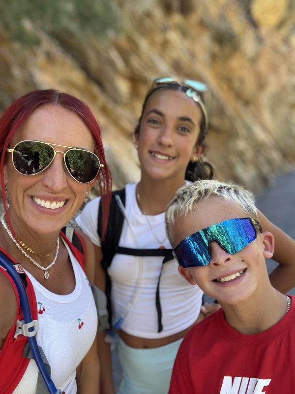 Cheyenne with both her children on a Utah canyon trail