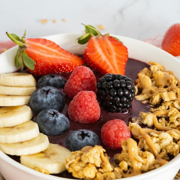 The Real Brazilian açaí bowl with strawberry, blackberry, banana, granola and peanut butter